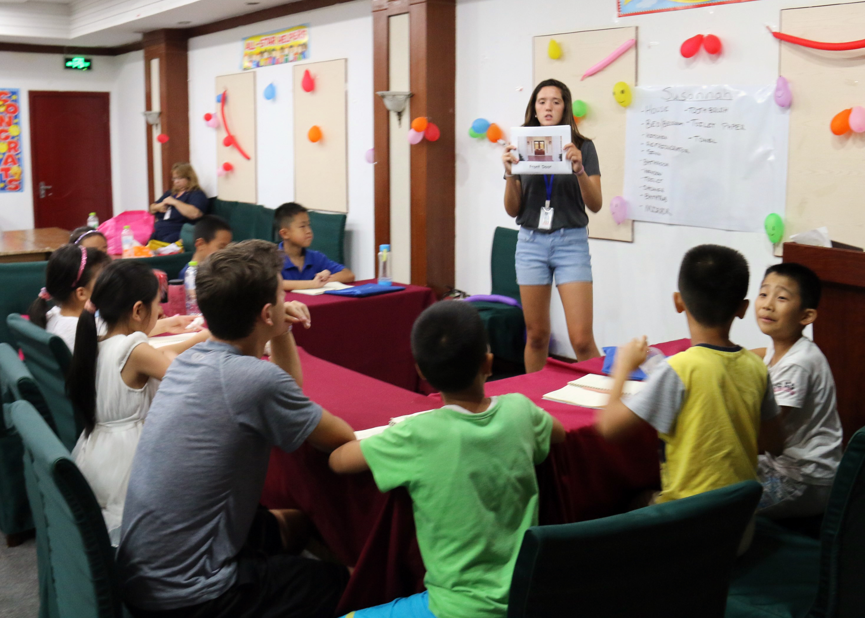 Children learning english in a group.